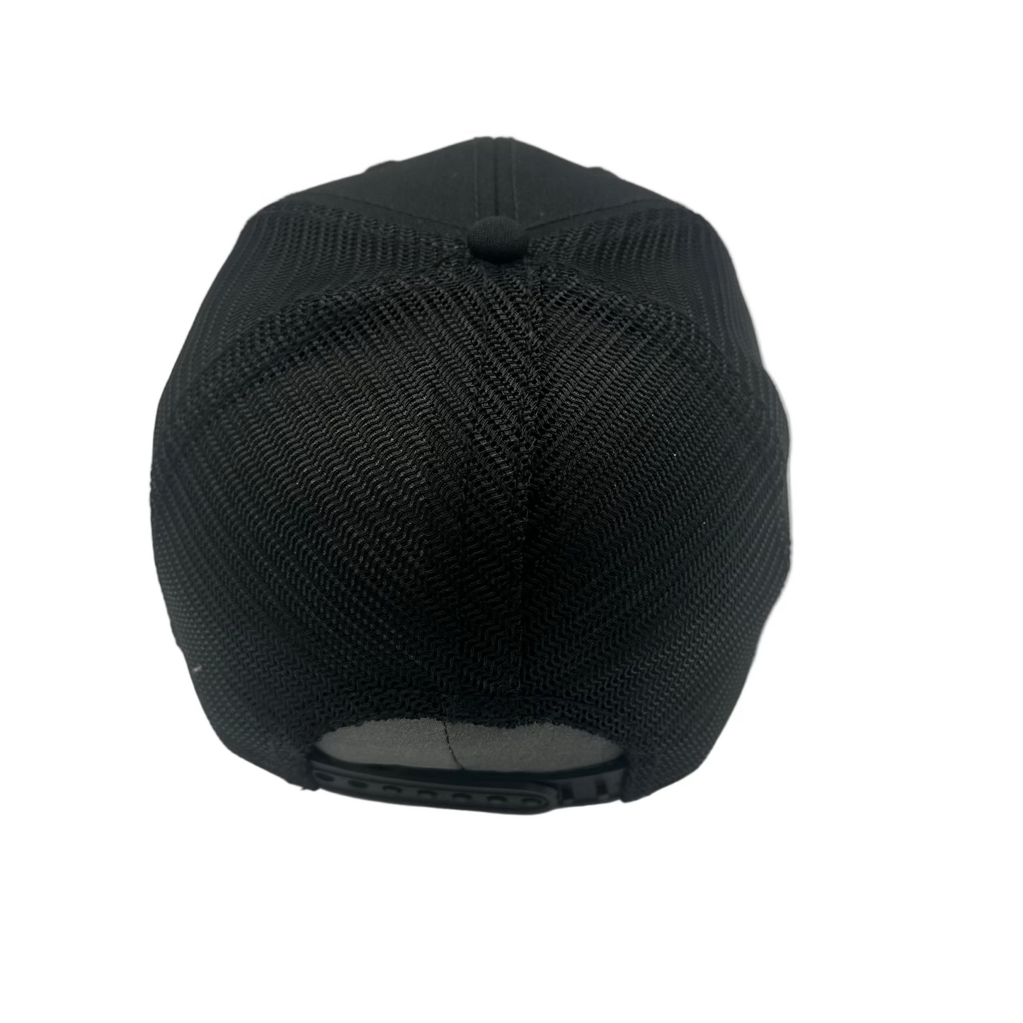 A black trucker-style baseball cap viewed from the back, showing the textured fabric front panels and a dark adjustable snap closure on a plain light background.